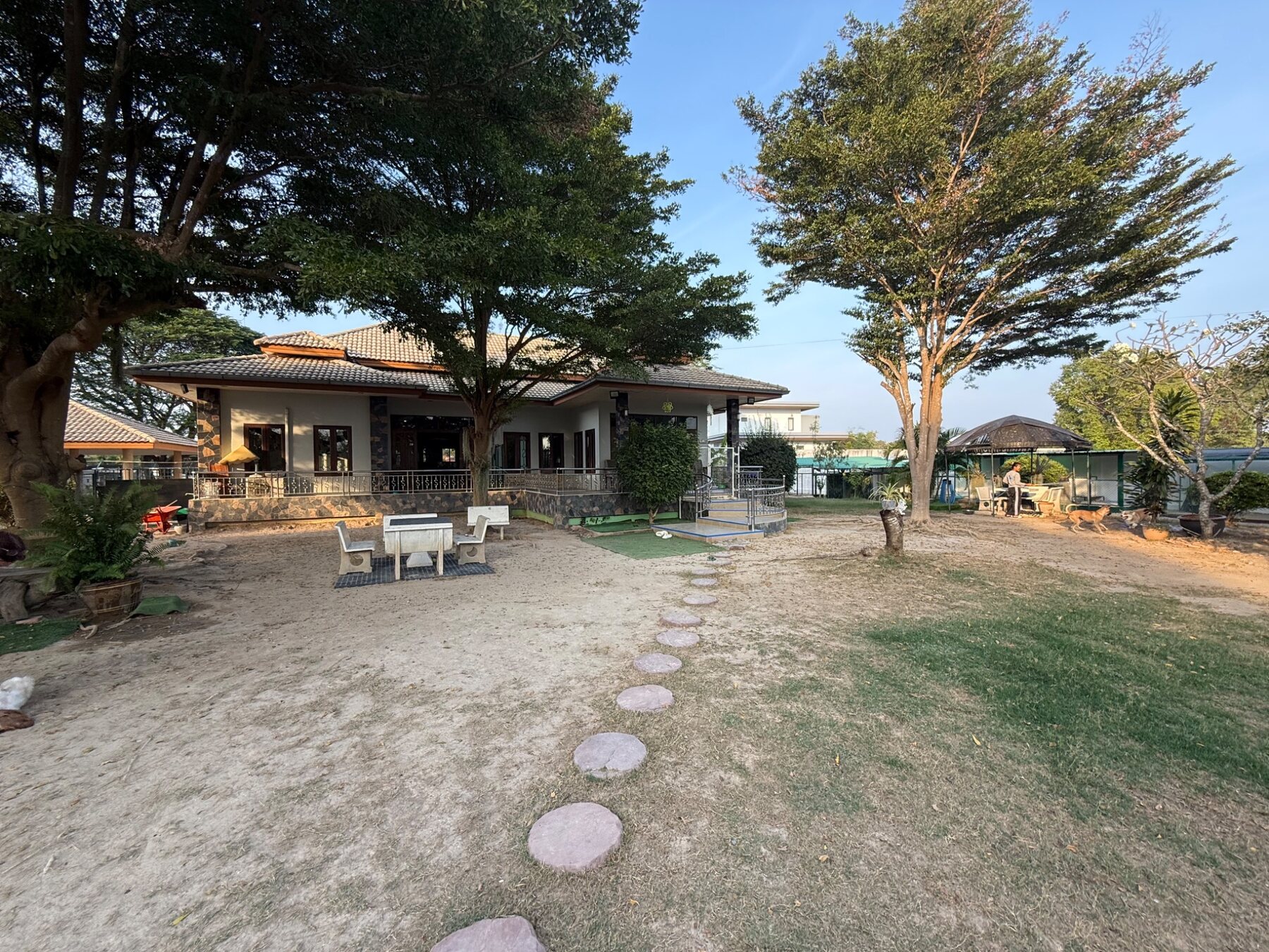 Main building and generous garden at Doggy Paradise